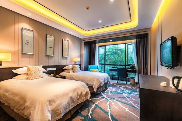 Deluxe Room | Desk, blackout curtains, free cots/infant beds, free WiFi