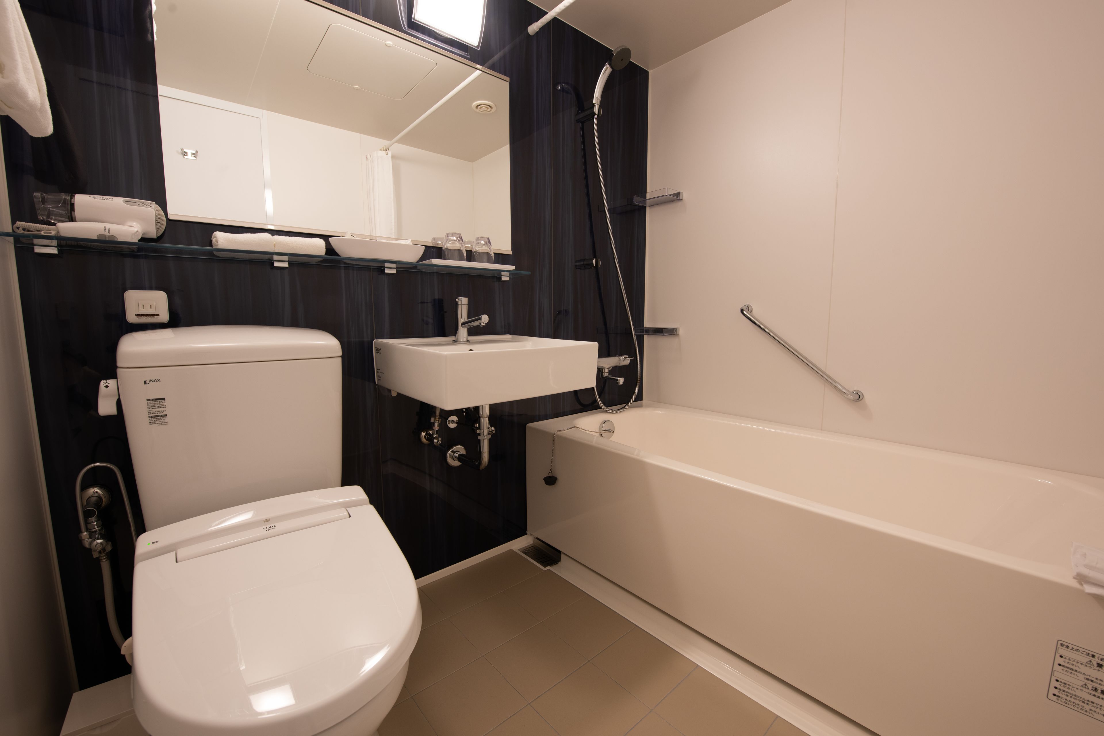 combined shower/bathtub, free toiletries, hair dryer, slippers