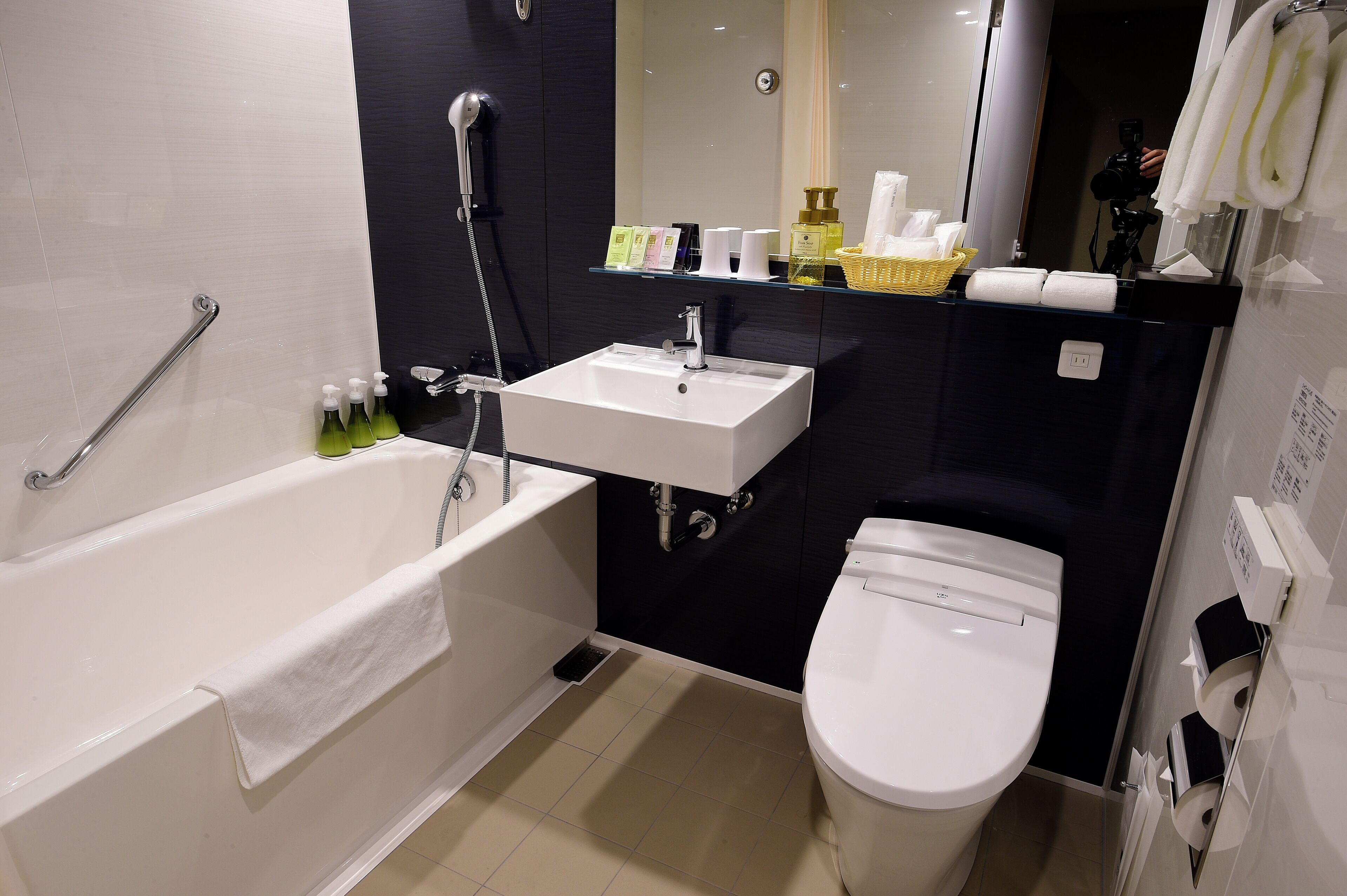 combined shower/bathtub, free toiletries, hair dryer, slippers