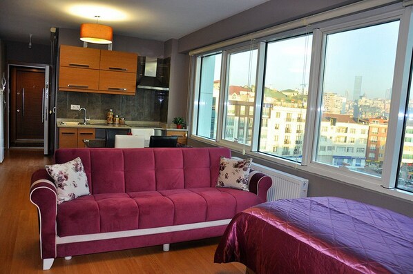 Appartement, 1 chambre | Aire de séjour | Téléviseur ACL