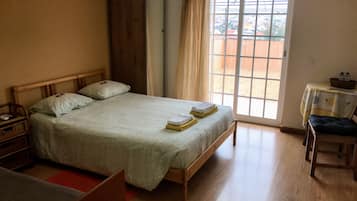Family Triple Room, Private Bathroom, Courtyard Area | Free WiFi, bed sheets