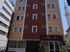 A multi-story building with a prominent "HOTEL META" sign. - Meta Hotel (Bursa)