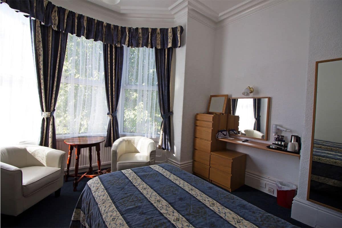 Twin Room | Iron/ironing board (on request), bed sheets