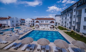 2 outdoor pools, pool umbrellas, pool loungers