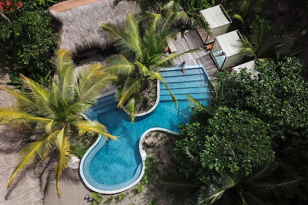 Outdoor pool, free cabanas, pool umbrellas