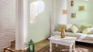 Deluxe Suite, 1 Queen Bed, Sea View | Living room | LCD TV