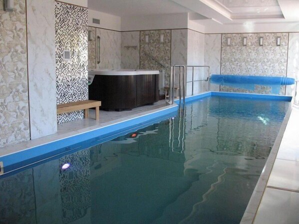 Indoor pool, open 7:00 AM to 10:00 PM, pool loungers