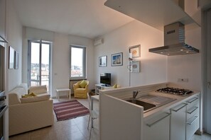 Appartement, 1 chambre | Coin séjour | Télévision à écran plat