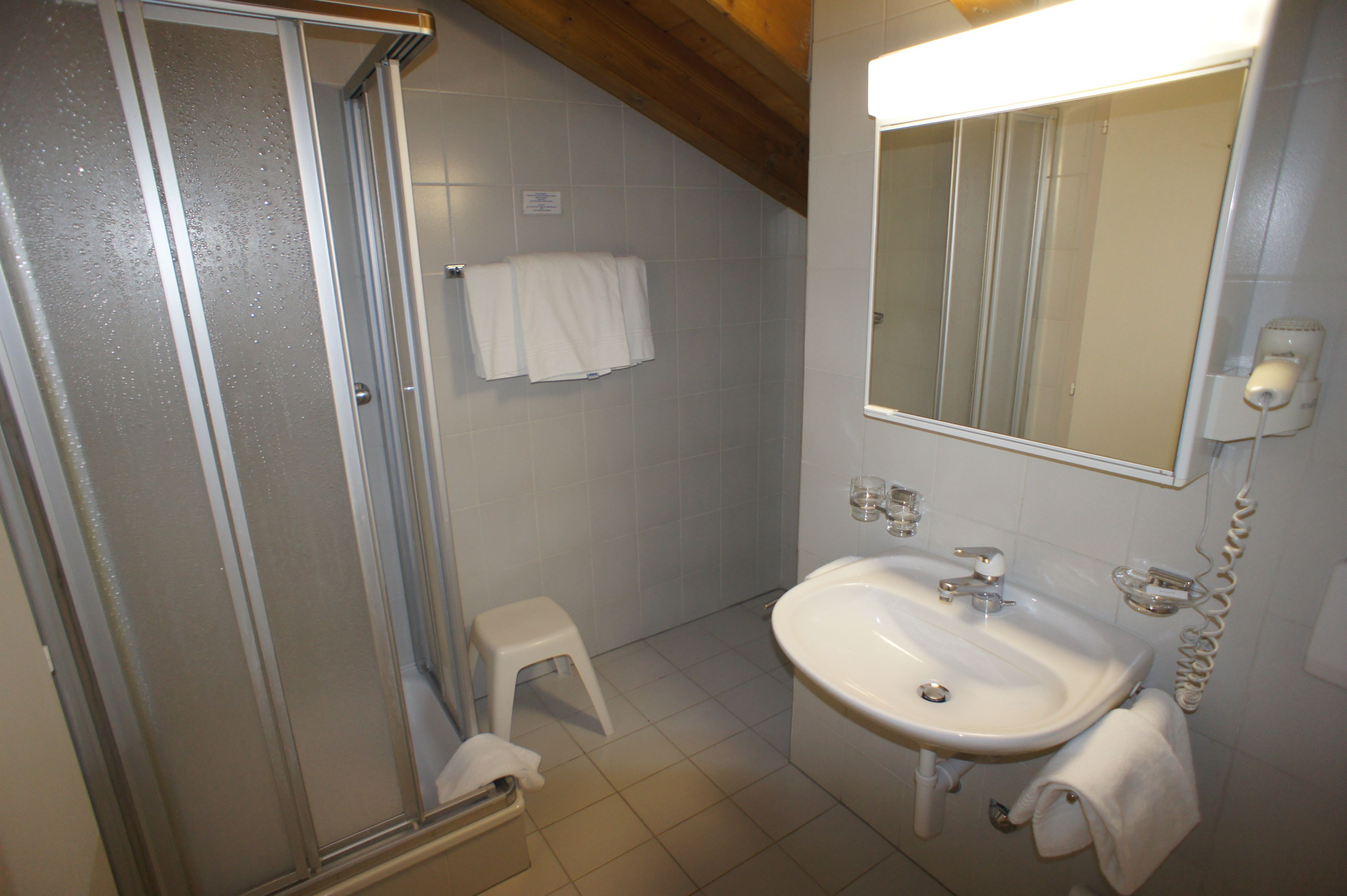 deluxe quadruple room, mountain view | bathroom | shower, hair dryer, towels, soap