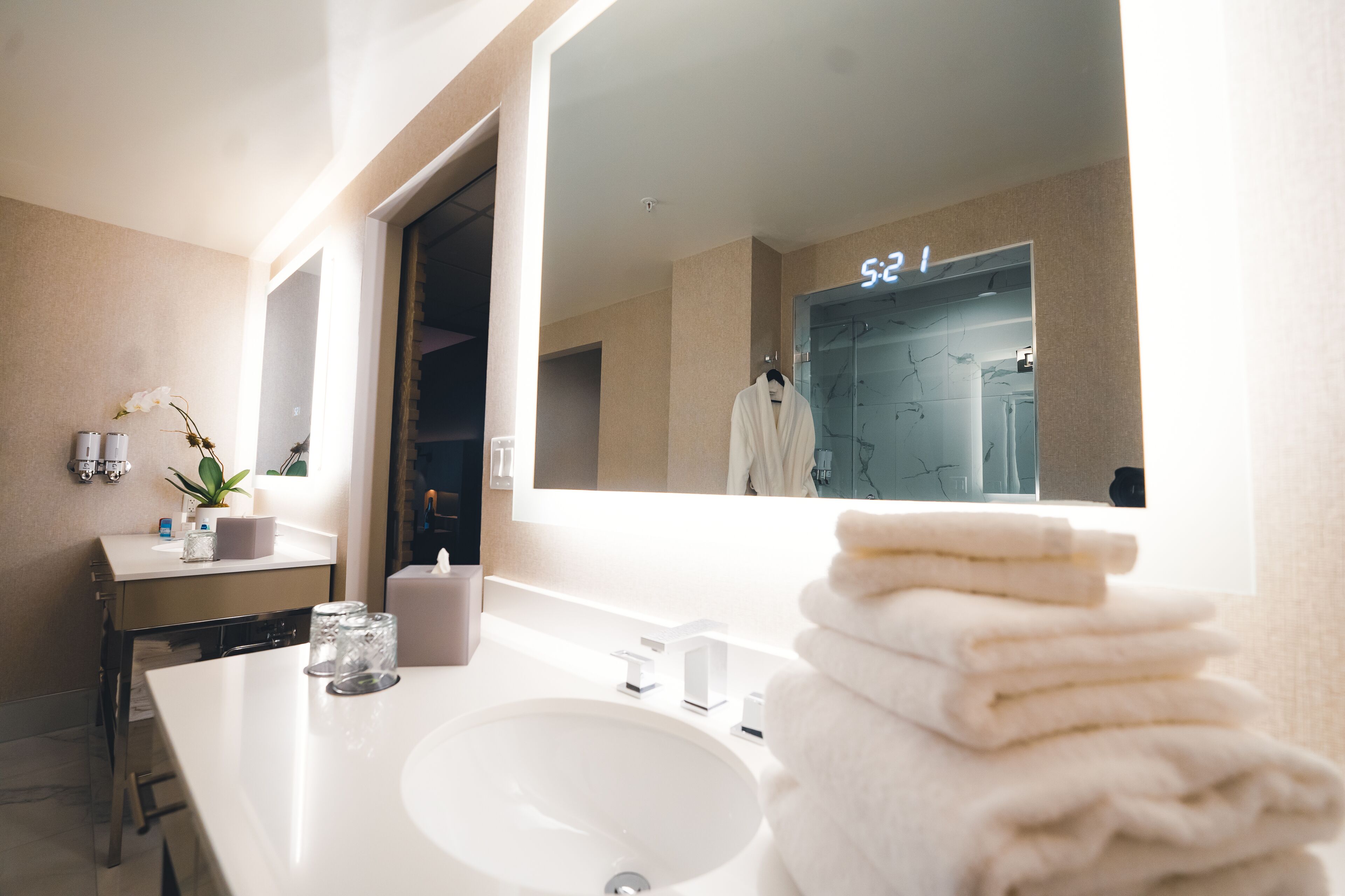 luxury king suite | bathroom | shower, free toiletries, hair dryer, towels