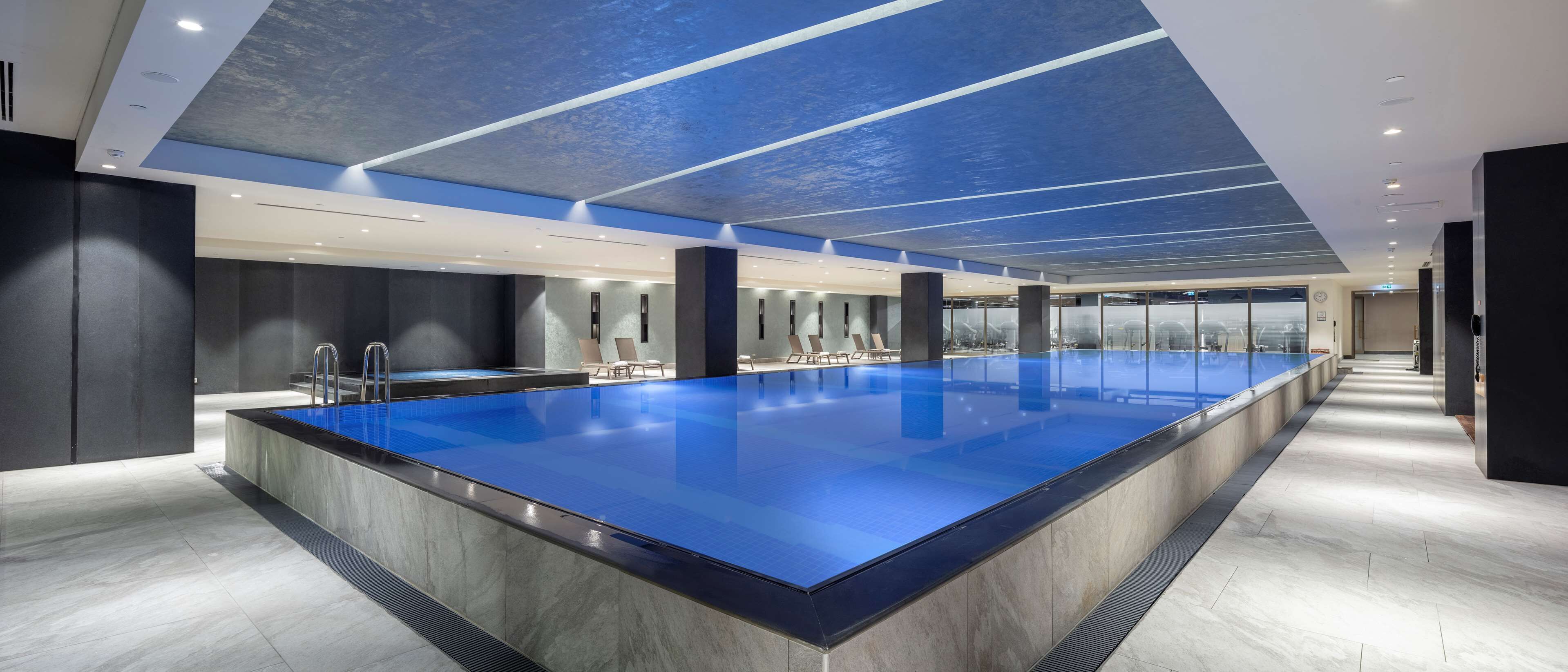 Indoor pool, seasonal outdoor pool, pool umbrellas, pool loungers