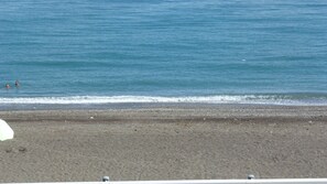 On the beach, sun loungers