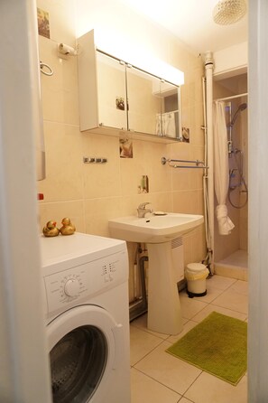 Shower, hair dryer, towels, soap