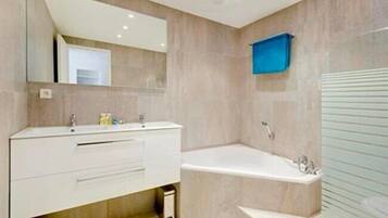 Shower, hair dryer, towels, toilet paper