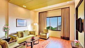 Suite, 1 Bedroom | Living room | LCD TV