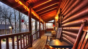 A wooden cabin with a porch, wooden chairs, and a red mailbox. - Sitting on 20 beautiful acres, totally secluded, Just 6 miles from Helen, GA! (Sautee Nacoochee)