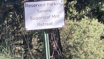 A sign indicating reserved parking at Serene Sugarloaf Mountain Retreat.