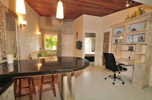 Enjoy meals and meetings in this room with a curved countertop and comfortable seating.