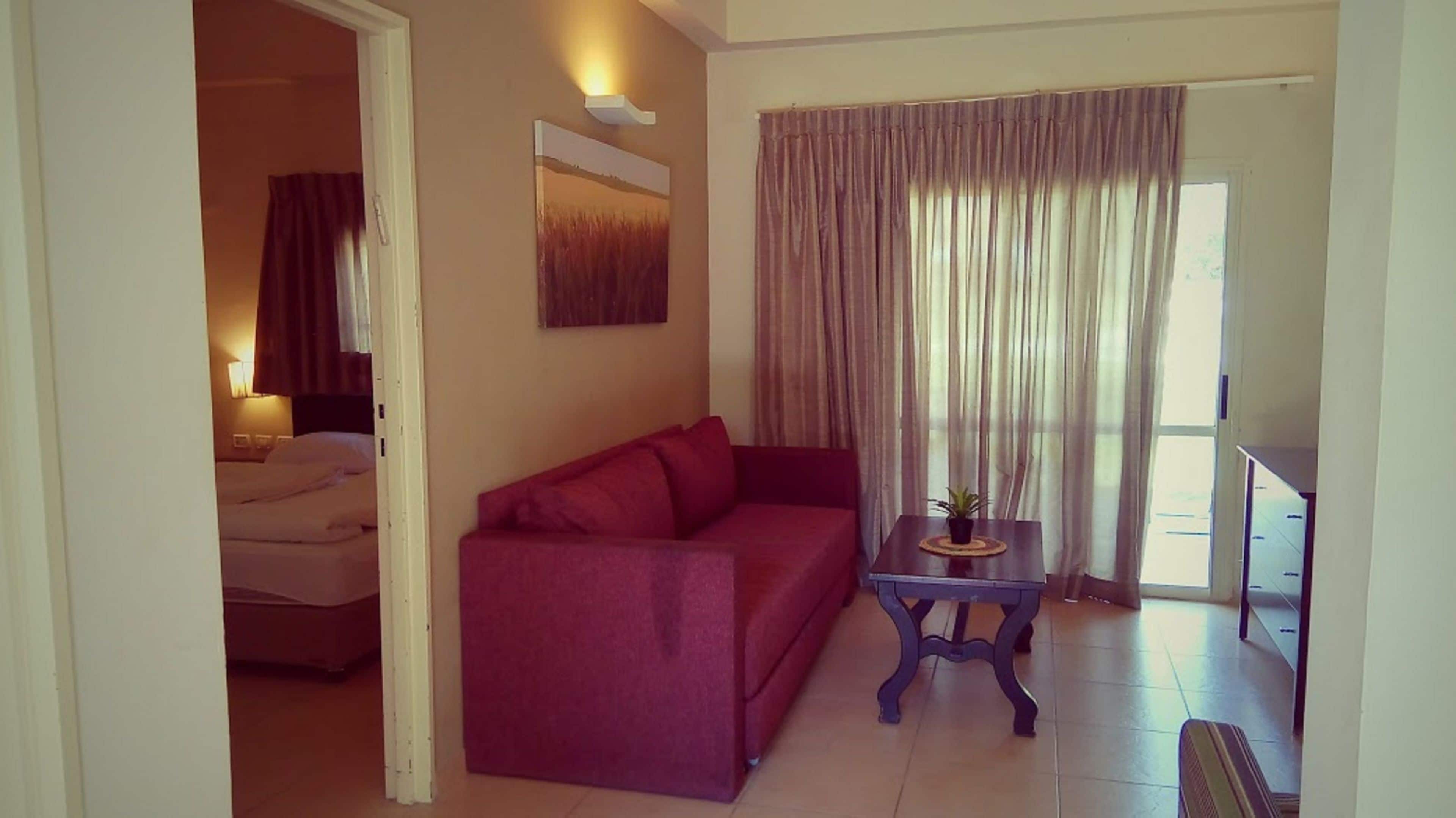 Apartment, 1 Bedroom | Living area | Flat-screen TV