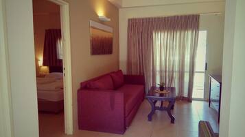 Apartment, 1 Bedroom | Living area | Flat-screen TV