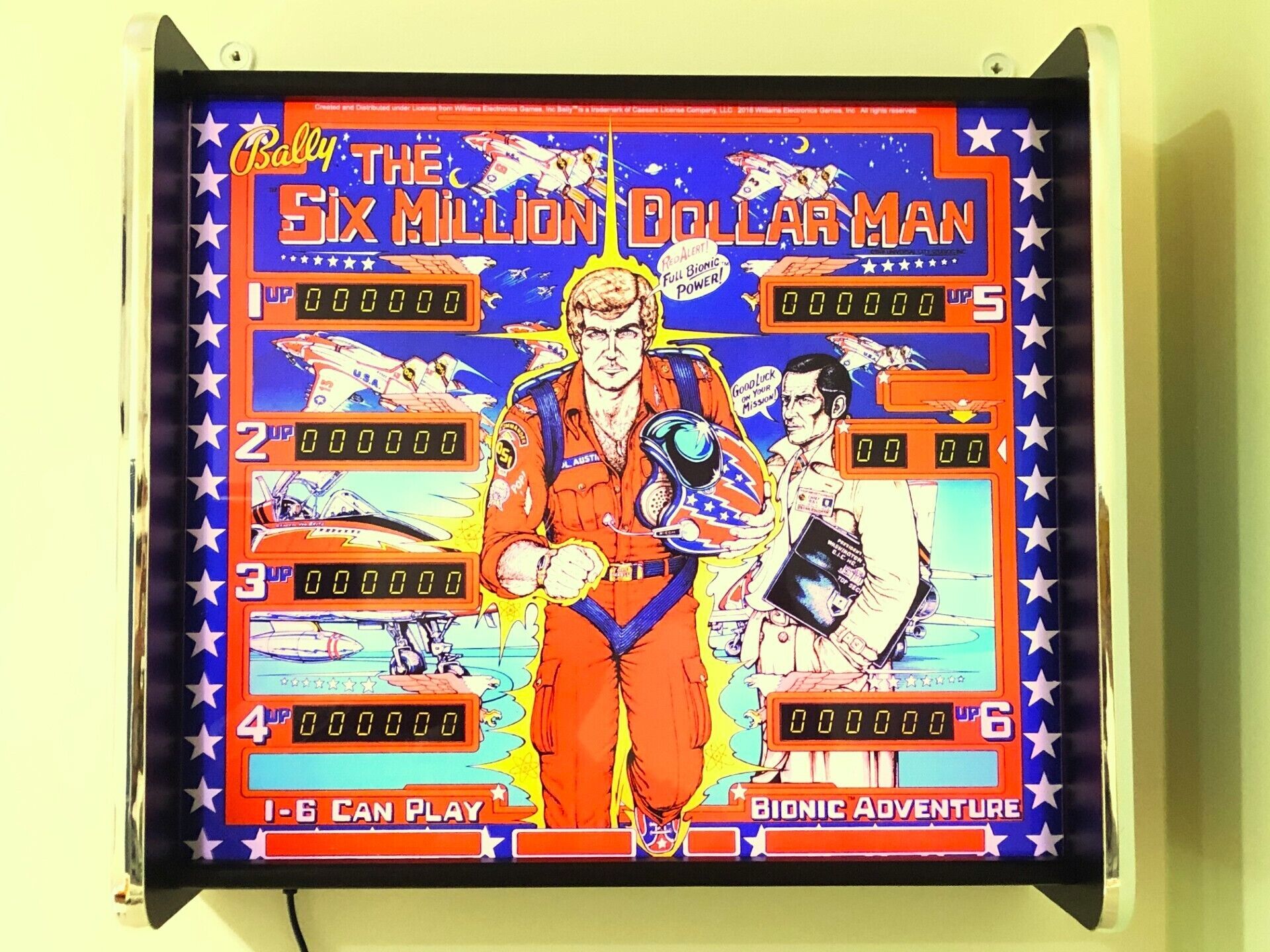 A pinball machine titled "The Six Million Dollar Man" with a bionic adventure theme.