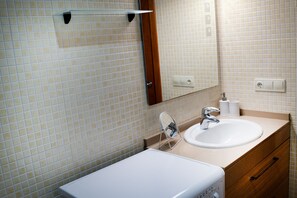 Bathtub, hair dryer, towels, soap