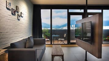 Deluxe Double Room, Balcony (VIP) | Living room | 50-inch LCD TV with cable channels, TV