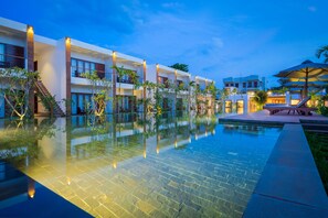 2 outdoor pools, open 7:00 AM to 10:00 PM, pool loungers