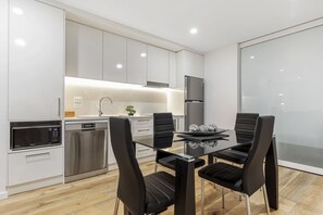One Bedroom + Study with Harbour View | Private kitchen | Full-sized fridge, microwave, oven, stovetop - Astra Apartments Newcastle West (Newcastle West)