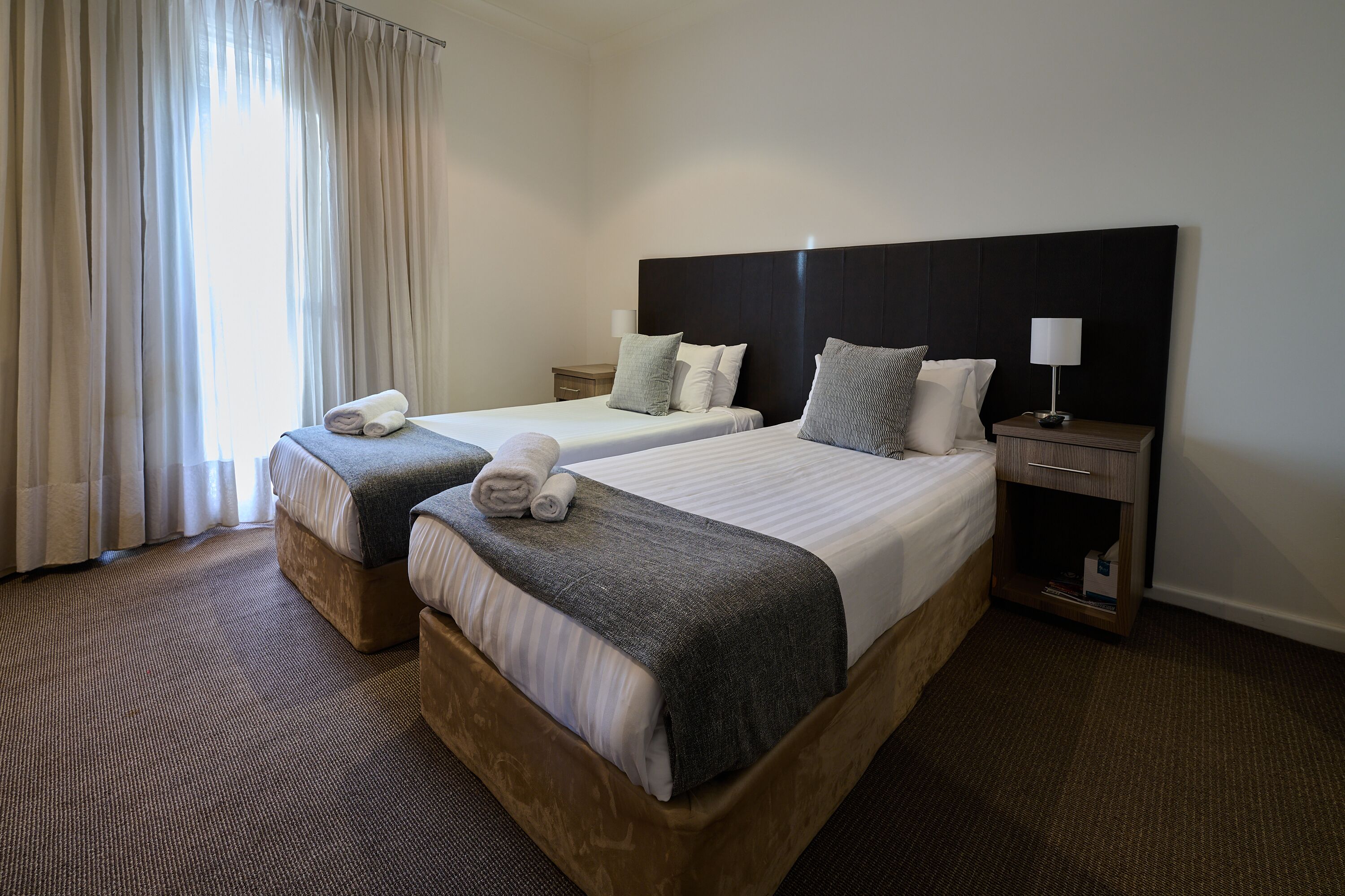 standard twin room (shared bathroom) | premium bedding, desk, laptop workspace, iron/ironing board