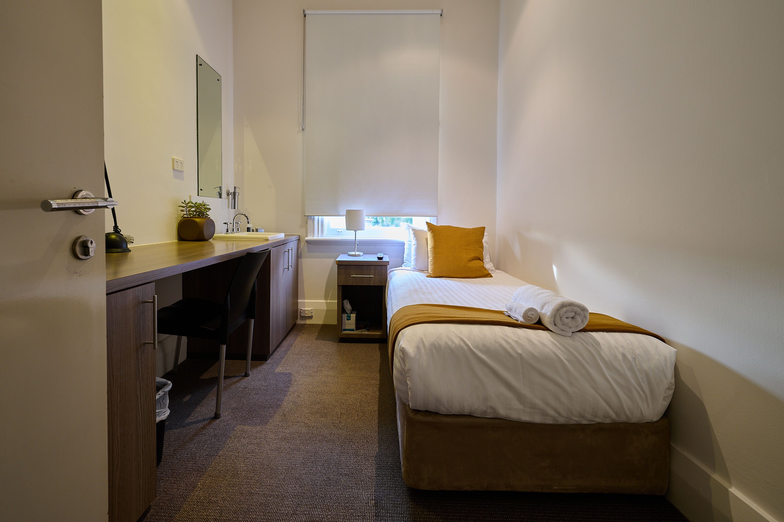standard single room (shared bathroom) | premium bedding, desk, laptop workspace, iron/ironing board