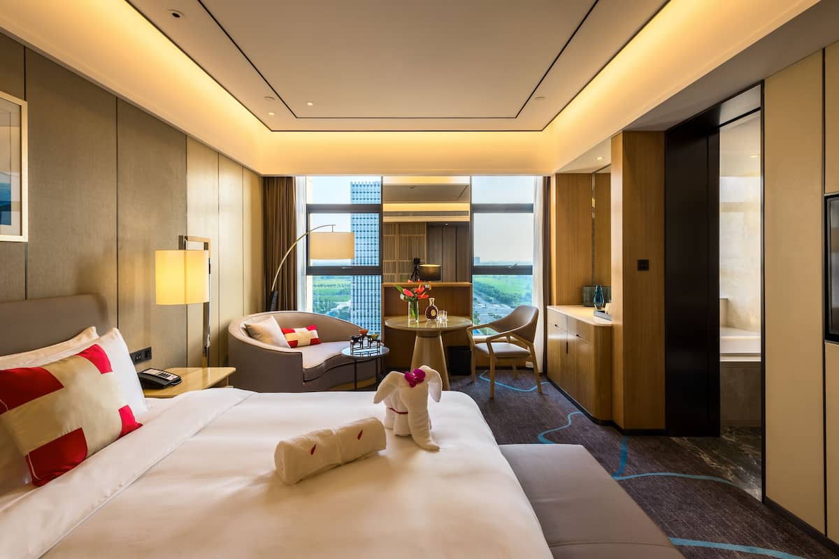 Premier kamer | Luxe beddengoed, donsdekens, een minibar, een kluis op de kamer