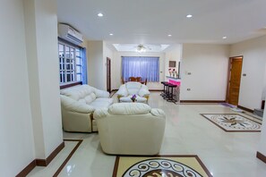 5-Bedroom Private Pool Villa | Living area | 55-inch LCD TV with cable channels, TV - The Jomtien Modern Pool Villa (Pattaya)