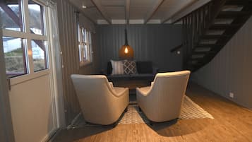 Cabin, Beachfront | Living area | Flat-screen TV