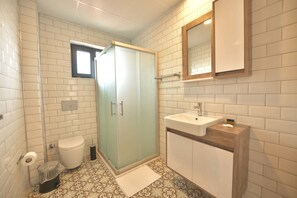 Shower, free toiletries, hair dryer, slippers