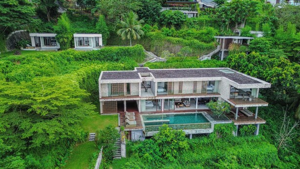 A multi-story house with a pool, surrounded by lush greenery. - Selong Selo Resort and Villas (Selong Belanak)