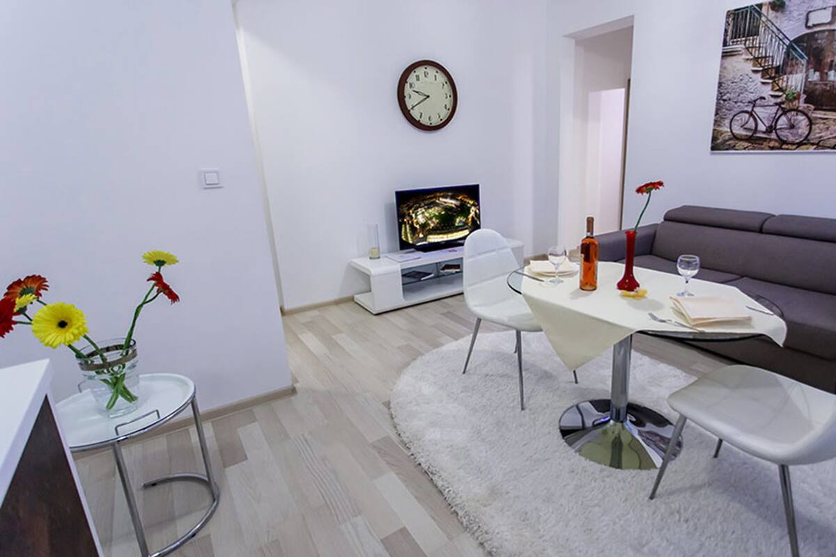 Deluxe Apartment, 1 Bedroom | Living area | Flat-screen TV