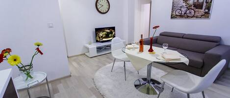 Deluxe Apartment, 1 Bedroom | Living area | Flat-screen TV