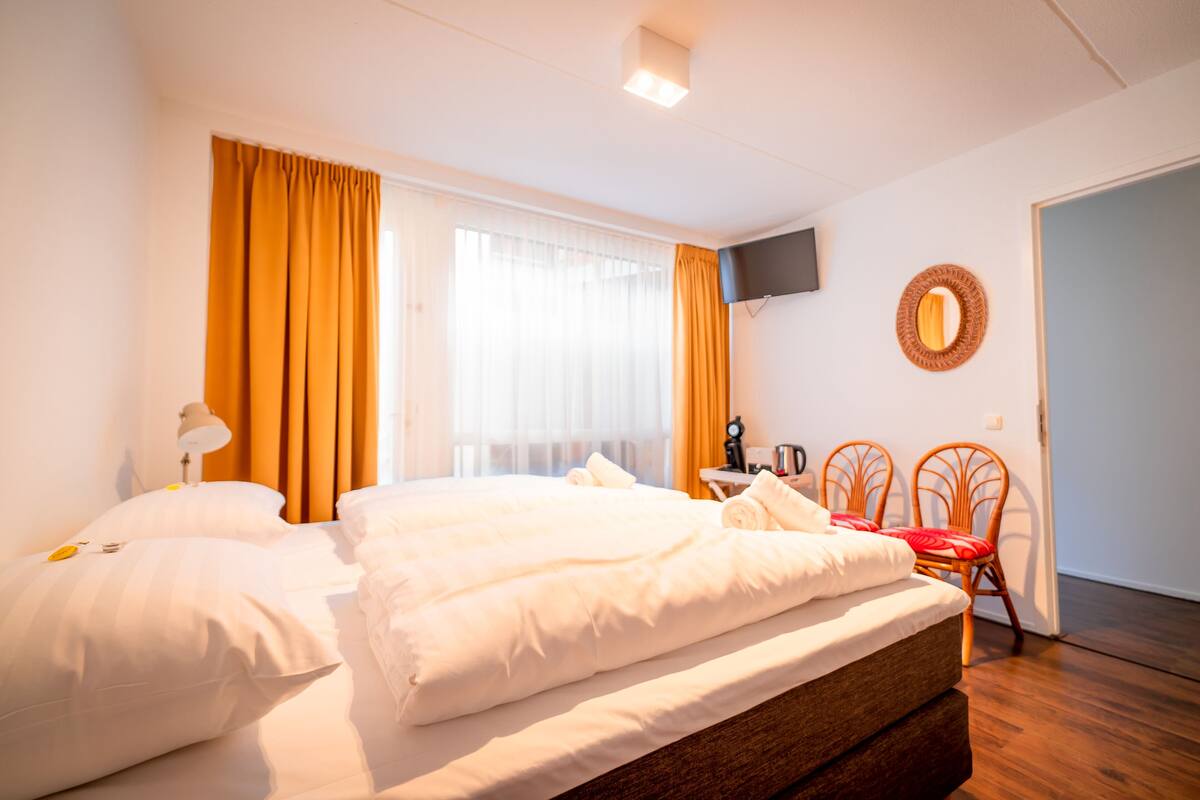 Premium bedding, memory-foam beds, blackout curtains, iron/ironing board