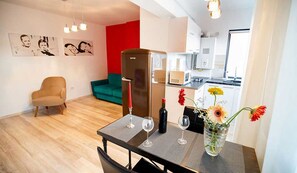 Deluxe Apartment, 1 Bedroom | Living area | Flat-screen TV