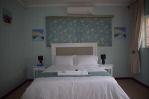 Family Studio Suite, 2 Queen Beds, 2 Bathrooms, Garden View | Desk, rollaway beds, free WiFi