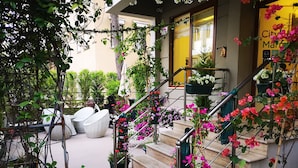 A staircase with metal railings, surrounded by potted plants and flowers. - City Hotel Marmaris (Marmaris)