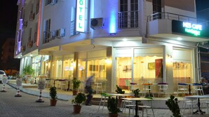 A hotel with a prominent sign reading "MELTEM HOTEL" and a visible restaurant named "HBS CAFE Hamburg". - Igneada Meltem Hotel (Demirköy)