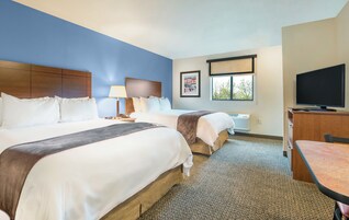 Premium bedding, pillowtop beds, desk, laptop workspace