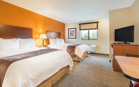 Premium bedding, pillowtop beds, desk, laptop workspace