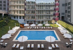 Seasonal outdoor pool, open 9:00 AM to 6:00 PM, pool umbrellas