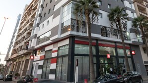 A multi-story hotel with a modern design, featuring a prominent 'Hotel' sign at the top. - ibis Mohammedia (Mohammedia)