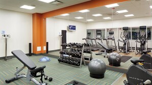 A gym with various exercise equipment including treadmills, stationary bikes, and free weights. - Holiday Inn Express & Suites-Cincinnati North - Liberty Way by IHG (West Chester)