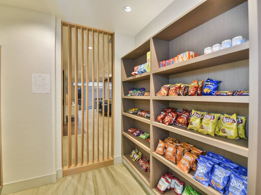 A snack aisle with various packaged snacks.