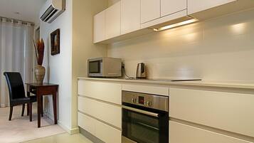 Apartment, 2 Bedrooms (Trieste 1) | Private kitchen | Full-sized fridge, microwave, oven, stovetop
